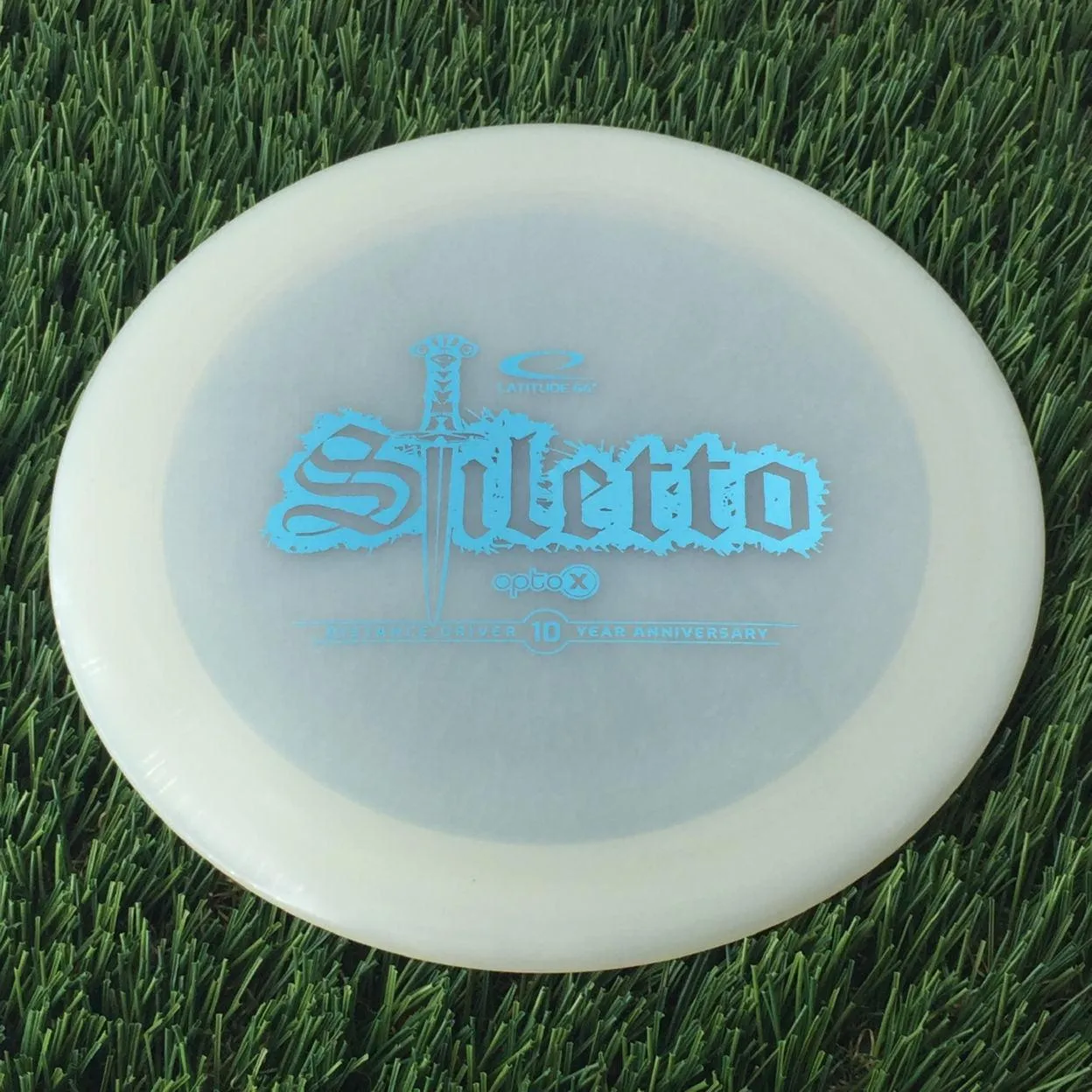Latitude 64 Opto-X Stiletto with 10 Year Anniversary Sword Stamp - 176g - Translucent White